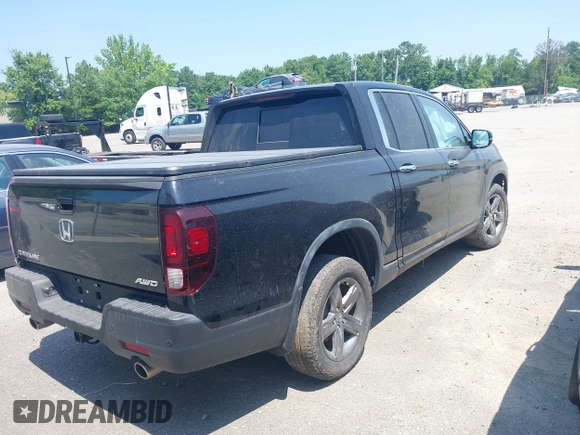 2022 Honda Ridgeline RTL-E with VIN 5FPYK3F75NB020232, listed as a IAAI auction lot 42549034 with 40,209 mi miles and . Bid and sale history available at DreamBid. Image 4.