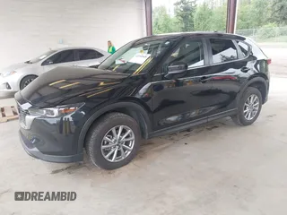 2023 Mazda CX-5 S Carbon Edition z VIN JM3KFBCM8P0140333, wystawiony jako IAAI lot #42292848 z przebiegiem 49 587 mil mil oraz . Historia ofert i sprzedaży dostępna na DreamBid. Obrazek 18.