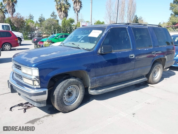 1999 Chevrolet Tahoe with VIN 1GNEC13R7XJ573387, listed as a IAAI auction lot 42001191 with 241,007 mi miles. Bid and sale history available at carsss.com. Image 2.
