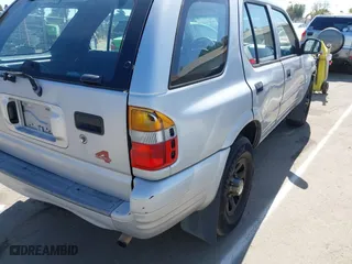 1998 Isuzu Rodeo S with VIN 4S2CM58WXW4325350, listed as a IAAI auction lot 42084411 with 292,784 mi miles. Bid and sale history available at carsss.com. Image 13.