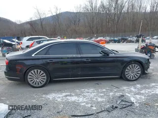 2015 Audi A8 L 4.0T with VIN WAU32AFD7FN006233, listed as a IAAI auction lot 41353034 with 119,693 mi miles. Bid and sale history available at carsss.com. Image 13.