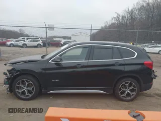 2017 BMW X1 xDrive28i with VIN WBXHT3C31H5F72958, listed as a IAAI auction lot 41782257 with 134,829 mi miles. Bid and sale history available at carsss.com. Image 14.