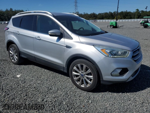 2017 Ford Escape Titanium with VIN 1FMCU0J90HUB04082, listed as a Copart auction lot 77814994 with 135,674 mi miles and Salvage Title. Bid and sale history available at carsss.com. Image 4.