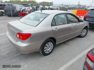2003 Toyota Corolla CE with VIN 1NXBR32E73Z137535, listed as a IAAI auction lot 42041727 with 243,586 mi miles. Bid and sale history available at carsss.com. Image 4.