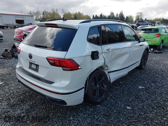 2023 Volkswagen Tiguan SE R-Line Black with VIN 3VVCB7AX3PM014446, listed as a IAAI auction lot 42016885 with 12,726 mi miles and . Bid and sale history available at DreamBid. Image 4.