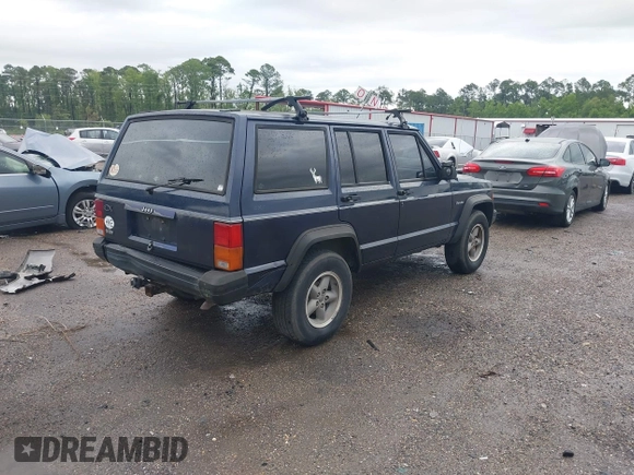 1996 Jeep Cherokee SE z VIN 1J4FJ28S5TL129065, wystawiony jako IAAI lot #42231133 z przebiegiem 225 320 mil mil oraz . Historia ofert i sprzedaży dostępna na DreamBid. Obrazek 4.