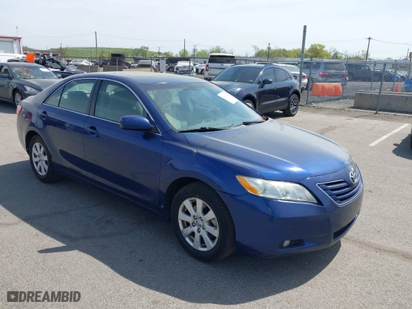 2007 Toyota Camry CE with VIN JTNBE46K373056707, listed as a IAAI auction lot 42128026 with 242,887 mi miles. Bid and sale history available at carsss.com. Image 1.