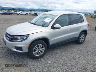 2013 Volkswagen Tiguan SEL with VIN WVGBV3AX1DW571843, listed as a IAAI auction lot 42540191 with 140,639 mi miles and . Bid and sale history available at DreamBid. Image 2.
