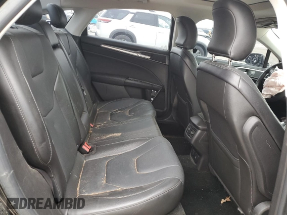 2016 Ford Fusion Titanium Hybrid z VIN 3FA6P0RU6GR139495, wystawiony jako Copart lot #52381235 z przebiegiem 138 534 mil mil oraz Czysty tytuł • Clean title. Historia ofert i sprzedaży dostępna na DreamBid. Obrazek 10.
