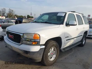 2001 GMC Yukon SLT with VIN 1GKEK13T41R171024, listed as a IAAI auction lot 41582633 with 216,077 mi miles. Bid and sale history available at carsss.com. Image 2.
