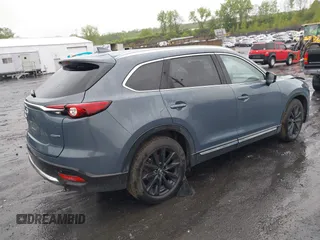 2021 Mazda CX-9 Grand Touring z VIN JM3TCBDY8M0528365, wystawiony jako IAAI lot #42222394 z przebiegiem 44 850 mil mil oraz . Historia ofert i sprzedaży dostępna na DreamBid. Obrazek 4.
