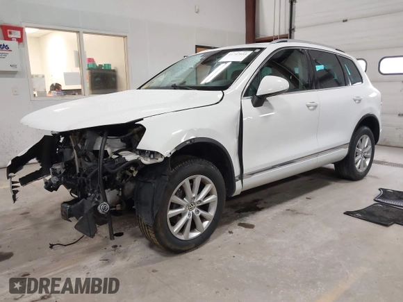 2014 Volkswagen Touareg Sport with VIN WVGEF9BP6ED005007, listed as a IAAI auction lot 41757033 with Not Provided miles and . Bid and sale history available at DreamBid. Image 17.