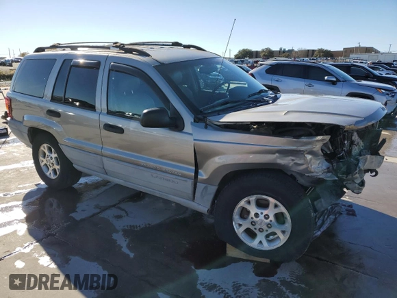 1999 Jeep Grand Cherokee Laredo with VIN 1J4GW58NXXC776438, listed as a Copart auction lot 84412044 with 163,060 mi miles and Salvage title. Bid and sale history available at DreamBid. Image 4.