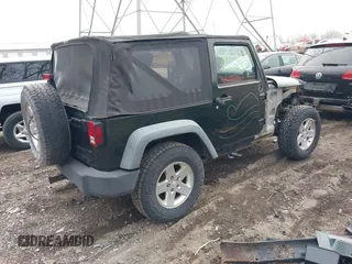 2011 Jeep Wrangler Sport with VIN 1J4AA2D18BL588273, listed as a IAAI auction lot 41857858 with 136,473 mi miles and . Bid and sale history available at carsss.com. Image 4.
