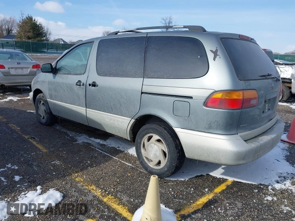 1999 Toyota Sienna LE with VIN 4T3ZF13C2XU118641, listed as a IAAI auction lot 41602097 with 261,792 mi miles. Bid and sale history available at carsss.com. Image 3.