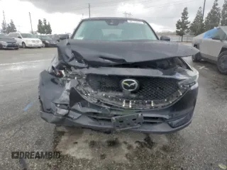 2020 Mazda CX-5 Grand Touring with VIN JM3KFADM3L0815055, listed as a Copart auction lot 48175245 with 56,602 mi miles and Salvage Title. Bid and sale history available at carsss.com. Image 5.