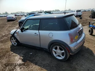 2004 MINI Hardtop with VIN WMWRC33454TJ56308, listed as a Copart auction lot 59690865 with 99,374 mi miles and Salvage title. Bid and sale history available at DreamBid. Image 2.
