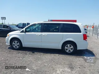 2012 Dodge Grand Caravan SXT with VIN 2C4RDGCG9CR200432, listed as a IAAI auction lot 42027477 with 99,076 mi miles and . Bid and sale history available at DreamBid. Image 14.