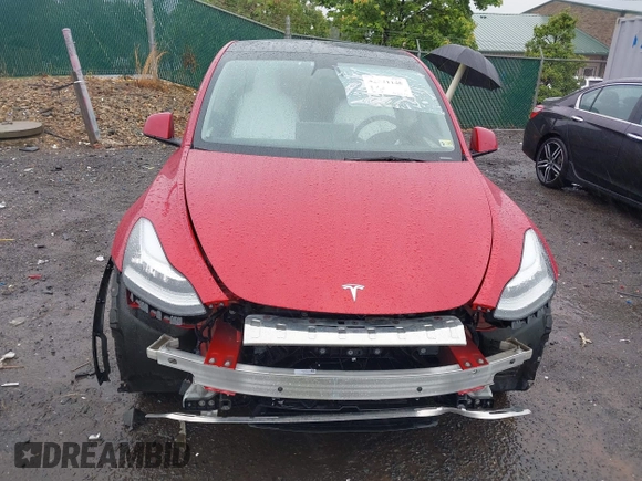 2023 Tesla Model Y Long Range with VIN 7SAYGDEE5PA111262, listed as a IAAI auction lot 42341148 with 19,014 mi miles and . Bid and sale history available at DreamBid. Image 6.
