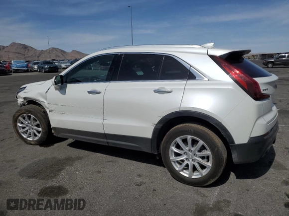 2023 Cadillac XT4 FWD Luxury with VIN 1GYAZAR46PF134602, listed as a Copart auction lot 54684865 with 13,221 mi miles and Salvage title. Bid and sale history available at DreamBid. Image 2.