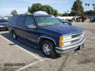 1999 Chevrolet Suburban with VIN 3GNEC16RXXG254126, listed as a Copart auction lot 52051405 with 113,554 mi miles and Clean title. Bid and sale history available at DreamBid. Image 4.