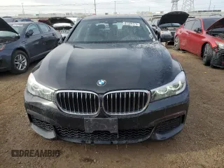 2019 BMW 7 Series 740i xDrive z VIN WBA7E4C50KGV28241, wystawiony jako Copart lot #87329774 z przebiegiem Nie podano mil oraz Szkoda całkowita • Salvage title. Historia ofert i sprzedaży dostępna na DreamBid. Obrazek 5.
