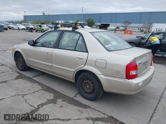 2000 Mazda Protege DX with VIN JM1BJ2223Y0212144, listed as a IAAI auction lot 41570436 with 221,430 mi miles and . Bid and sale history available at DreamBid. Image 3.