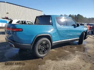 2022 Rivian R1T Launch Edition z VIN 7FCTGAAL7NN000539, wystawiony jako Copart lot #87811245 z przebiegiem Nie podano mil oraz Szkody całkowita. Historia ofert i sprzedaży dostępna na DreamBid. Obrazek 3.