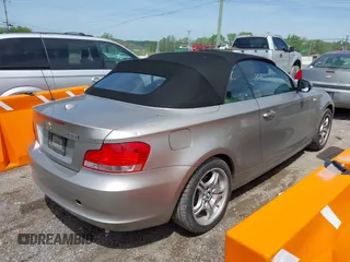 2011 BMW 1 Series 128i with VIN WBAUL7C5XBVE87044, listed as a IAAI auction lot 42095602 with 163,049 mi miles and . Bid and sale history available at carsss.com. Image 4.