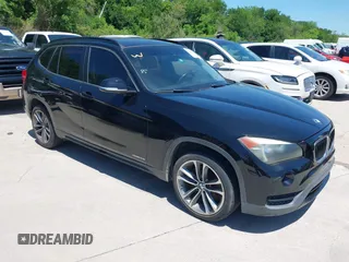 2014 BMW X1 sDrive28i with VIN WBAVM1C5XEVW51666, listed as a IAAI auction lot 42083936 with 176,465 mi miles. Bid and sale history available at carsss.com. Image 1.