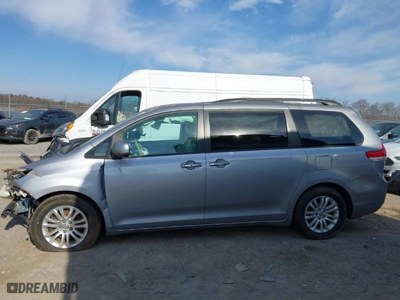 2012 Toyota Sienna XLE AAS with VIN 5TDYK3DC6CS181724, listed as a IAAI auction lot 41848192 with 100,973 mi miles. Bid and sale history available at carsss.com. Image 14.