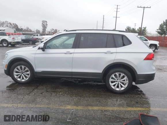 2018 Volkswagen Tiguan S z VIN 3VV1B7AX4JM121567, wystawiony jako IAAI lot #41581113 z przebiegiem Nie podano mil oraz . Historia ofert i sprzedaży dostępna na DreamBid. Obrazek 14.