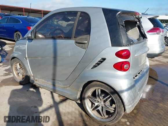 2009 Smart fortwo Pure with VIN WMEEJ31X09K301824, listed as a IAAI auction lot 42088793 with 51,948 mi miles. Bid and sale history available at carsss.com. Image 3.