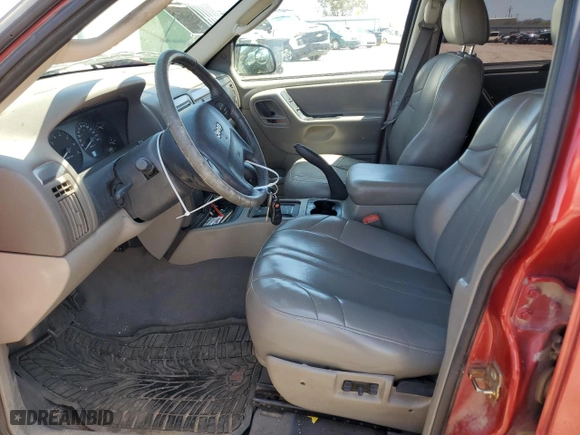2004 Jeep Grand Cherokee Laredo with VIN 1J4GW48N84C311923, listed as a Copart auction lot 52144535 with 231,069 mi miles and Salvage Title. Bid and sale history available at carsss.com. Image 7.