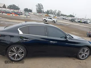2023 Infiniti Q50 Sensory z VIN JN1EV7CP9PM511527, wystawiony jako IAAI lot #42490195 z przebiegiem 34 031 mil mil oraz . Historia ofert i sprzedaży dostępna na DreamBid. Obrazek 13.