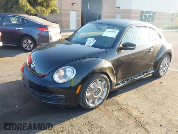 2012 Volkswagen Beetle 2.5L w/Sound/Nav PZEV with VIN 3VWJP7AT7CM661055, listed as a IAAI auction lot 41980159 with 113,678 mi miles and . Bid and sale history available at DreamBid. Image 2.
