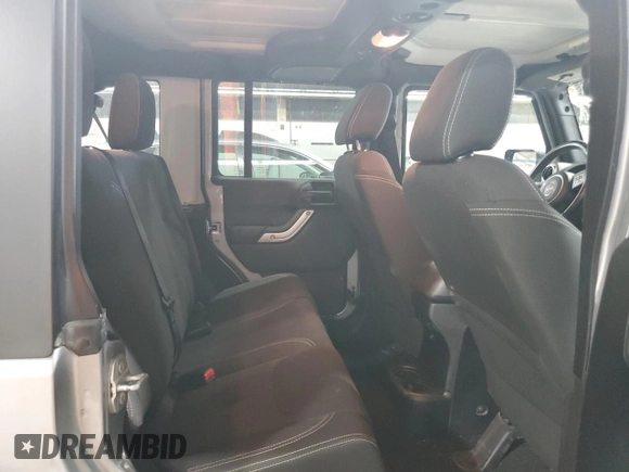 2015 Jeep Wrangler Unlimited Sahara with VIN 1C4BJWEG5FL743663, listed as a Copart auction lot 60205225 with 69,922 mi miles and Salvage title. Bid and sale history available at DreamBid. Image 11.
