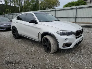 2015 BMW X6 xDrive50i with VIN 5UXKU6C51F0F94180, listed as a Copart auction lot 55306944 with 98,590 mi miles and Salvage Title. Bid and sale history available at carsss.com. Image 4.