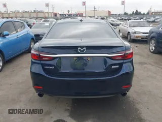 2018 Mazda 6 Grand Touring with VIN JM1GL1TY3J1334600, listed as a IAAI auction lot 41060893 with 64,852 mi miles and . Bid and sale history available at DreamBid. Image 17.