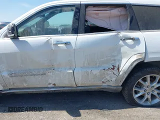 2014 Jeep Grand Cherokee Summit z VIN 1C4RJFJG3EC213145, wystawiony jako IAAI lot #41918145 z przebiegiem 176 460 mil mil oraz . Historia ofert i sprzedaży dostępna na DreamBid. Obrazek 6.