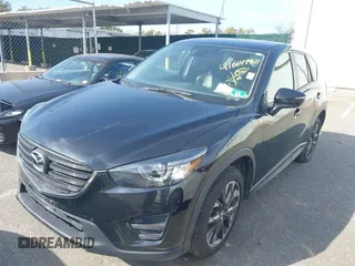 2016 Mazda CX-5 Grand Touring with VIN JM3KE4DY5G0681436, listed as a IAAI auction lot 41664780 with 172,199 mi miles. Bid and sale history available at carsss.com. Image 2.