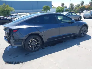 2023 Tesla Model 3 with VIN 5YJ3E1EAXPF405588, listed as a IAAI auction lot 42348952 with 30,788 mi miles and . Bid and sale history available at DreamBid. Image 4.