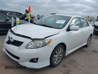 2010 Toyota Corolla with VIN 2T1BU4EEXAC521114, listed as a IAAI auction lot 42066903 with 208,509 mi miles. Bid and sale history available at carsss.com. Image 2.
