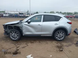2021 Mazda CX-5 Grand Touring with VIN JM3KFBDM4M0371496, listed as a IAAI auction lot 42428860 with 113,735 mi miles and . Bid and sale history available at DreamBid. Image 15.