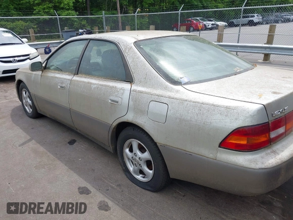 1998 Lexus ES 300 Luxury Sport Sdn with VIN JT8BF28G2W5023651, listed as a IAAI auction lot 42106837 with 245,107 mi miles. Bid and sale history available at carsss.com. Image 3.