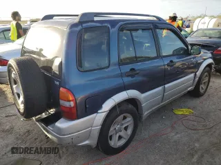 2003 Suzuki Grand Vitara z VIN JS3TE62V534100751, wystawiony jako Copart lot #76714894 z przebiegiem Nie podano mil oraz Nie do naprawy • Non repairable. Historia ofert i sprzedaży dostępna na DreamBid. Obrazek 3.