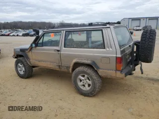 1993 Jeep Cherokee Sport with VIN 1J4FJ67S6PL580133, listed as a Copart auction lot 43230005 with 122,173 mi miles and Salvage Title. Bid and sale history available at carsss.com. Image 2.