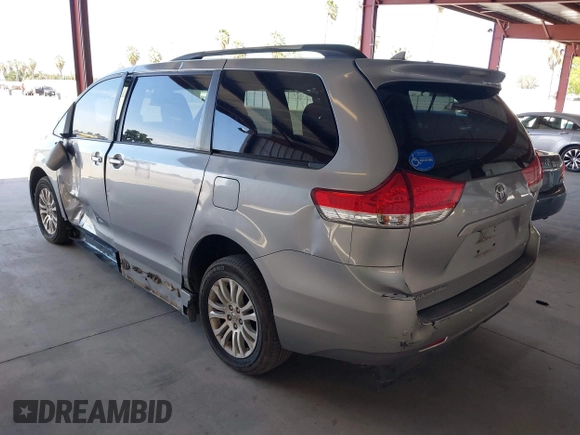 2011 Toyota Sienna XLE AAS with VIN 5TDYK3DC0BS107522, listed as a IAAI auction lot 42207305 with 171,857 mi miles and . Bid and sale history available at DreamBid. Image 3.