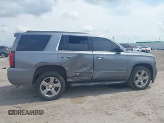 2019 Chevrolet Tahoe LT z VIN 1GNSCBKC8KR406519, wystawiony jako IAAI lot #42145021 z przebiegiem 74 694 mil mil oraz . Historia ofert i sprzedaży dostępna na DreamBid. Obrazek 6.