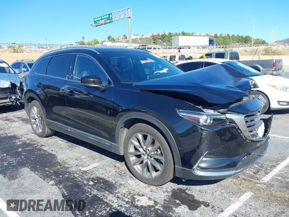 2018 Mazda CX-9 Grand Touring z VIN JM3TCADY8J0221221, wystawiony jako IAAI lot #41644721 z przebiegiem 41 510 mil mil oraz . Historia ofert i sprzedaży dostępna na DreamBid. Obrazek 1.